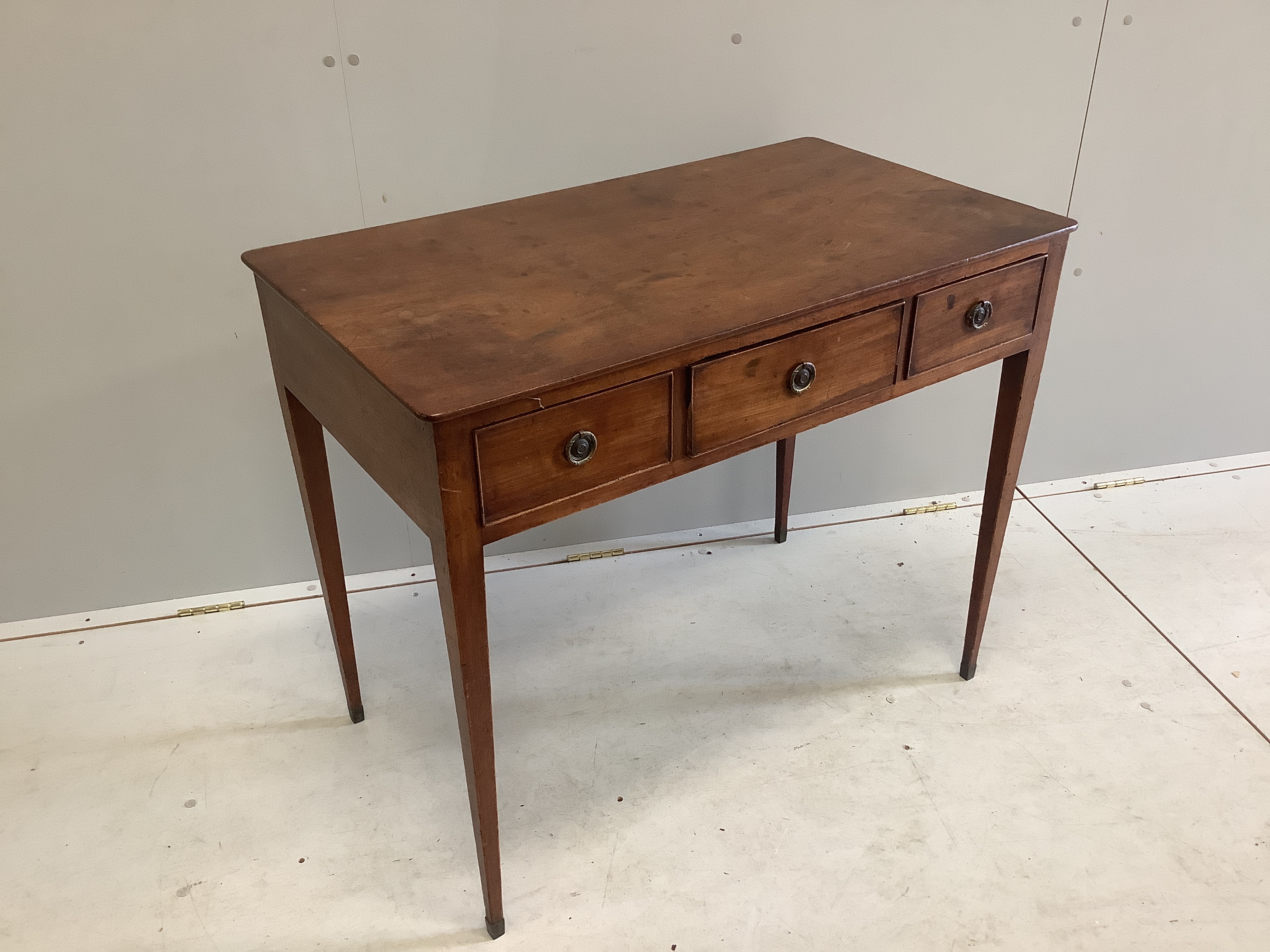 A George III mahogany three drawer side table, width 91cm, depth 52cm, height 75cm